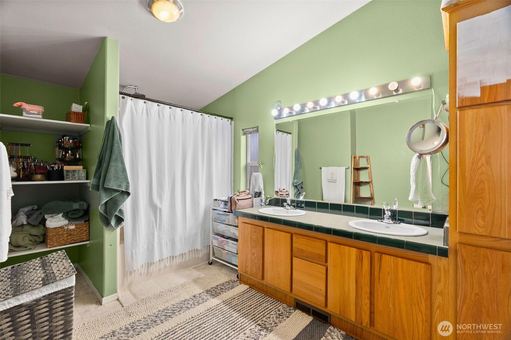 7808 197th Avenue Southwest Rochester, WA 98579 - Photo 18 of 37 a bathroom with a double vanity sink and a mirror