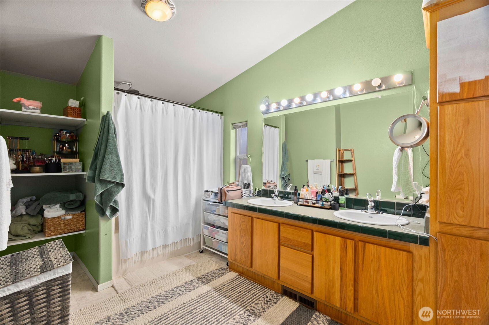 7808 197th Avenue Southwest Rochester, WA 98579 - Photo 19 of 37 a bathroom with a double vanity sink and a mirror