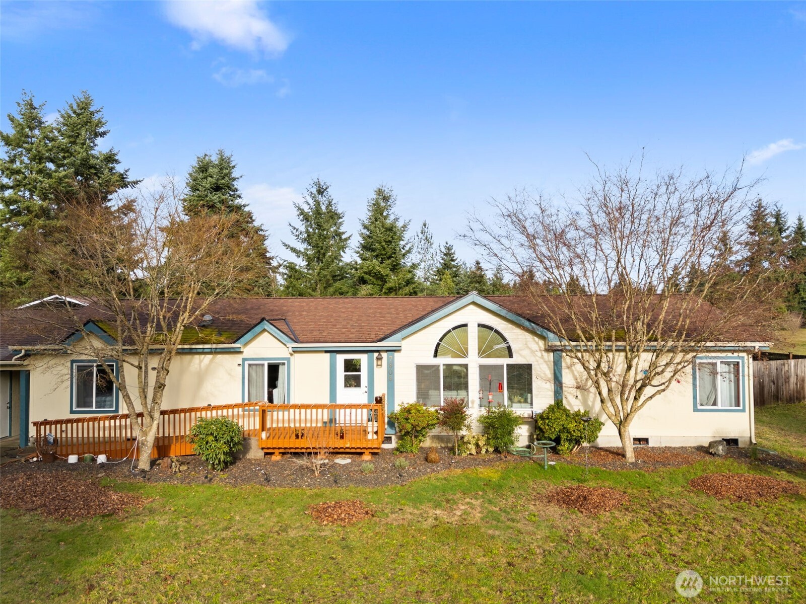 7808 197th Avenue Southwest Rochester, WA 98579 - Photo 2 of 37 a front view of a house with a yard