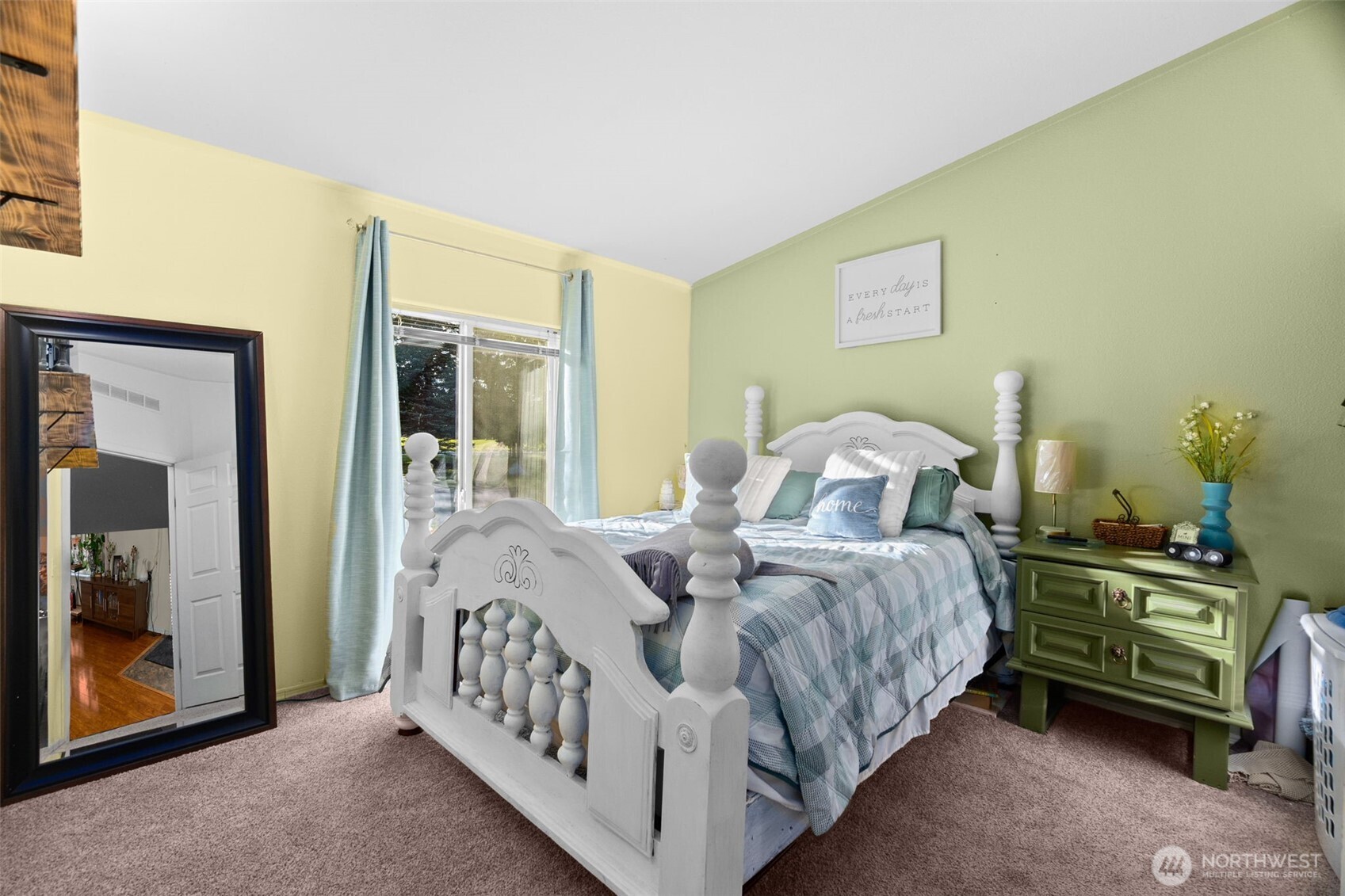 7808 197th Avenue Southwest Rochester, WA 98579 - Photo 21 of 37 a bed sitting in a bedroom next to a window