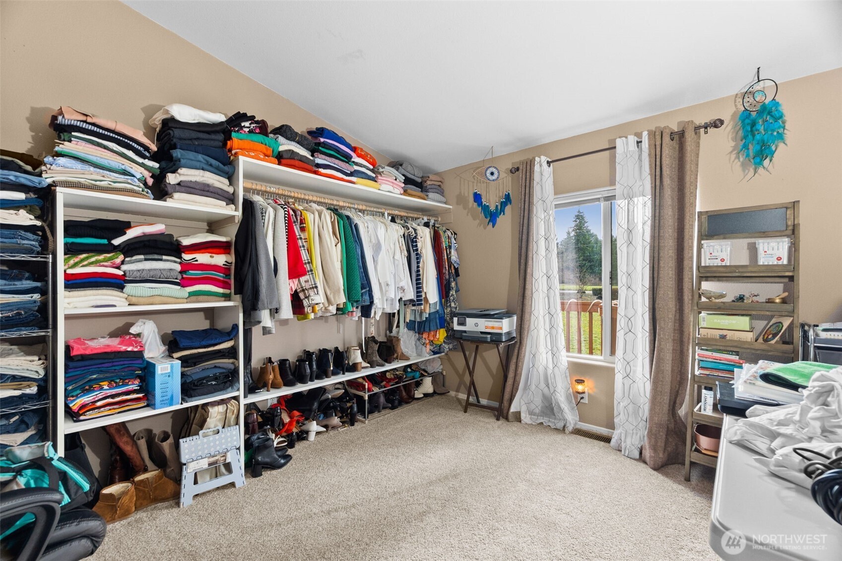7808 197th Avenue Southwest Rochester, WA 98579 - Photo 24 of 37 a view of walk in closet with clothes and shoes