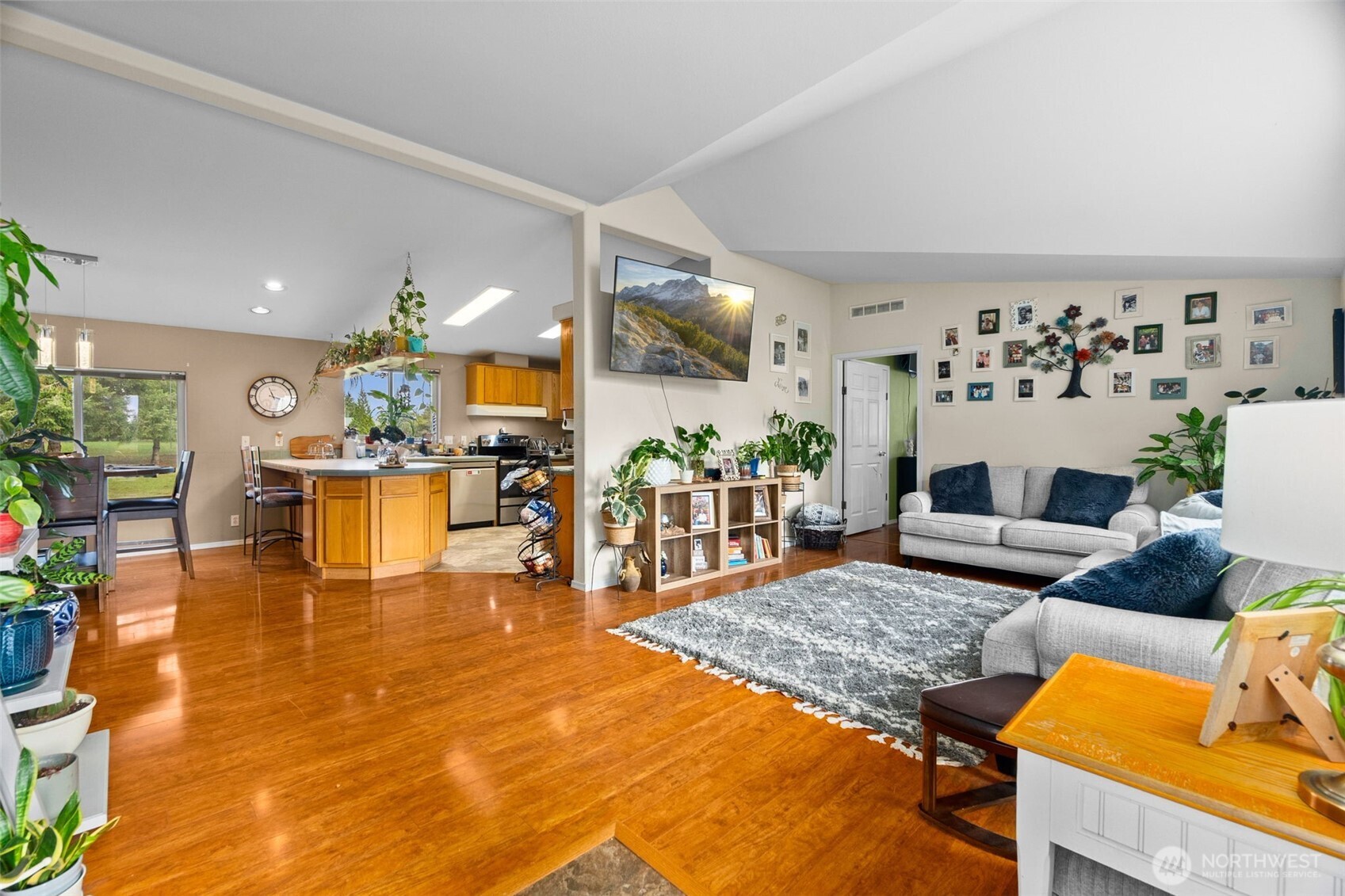 7808 197th Avenue Southwest Rochester, WA 98579 - Photo 3 of 37 a living room with fireplace furniture and a view of kitchen