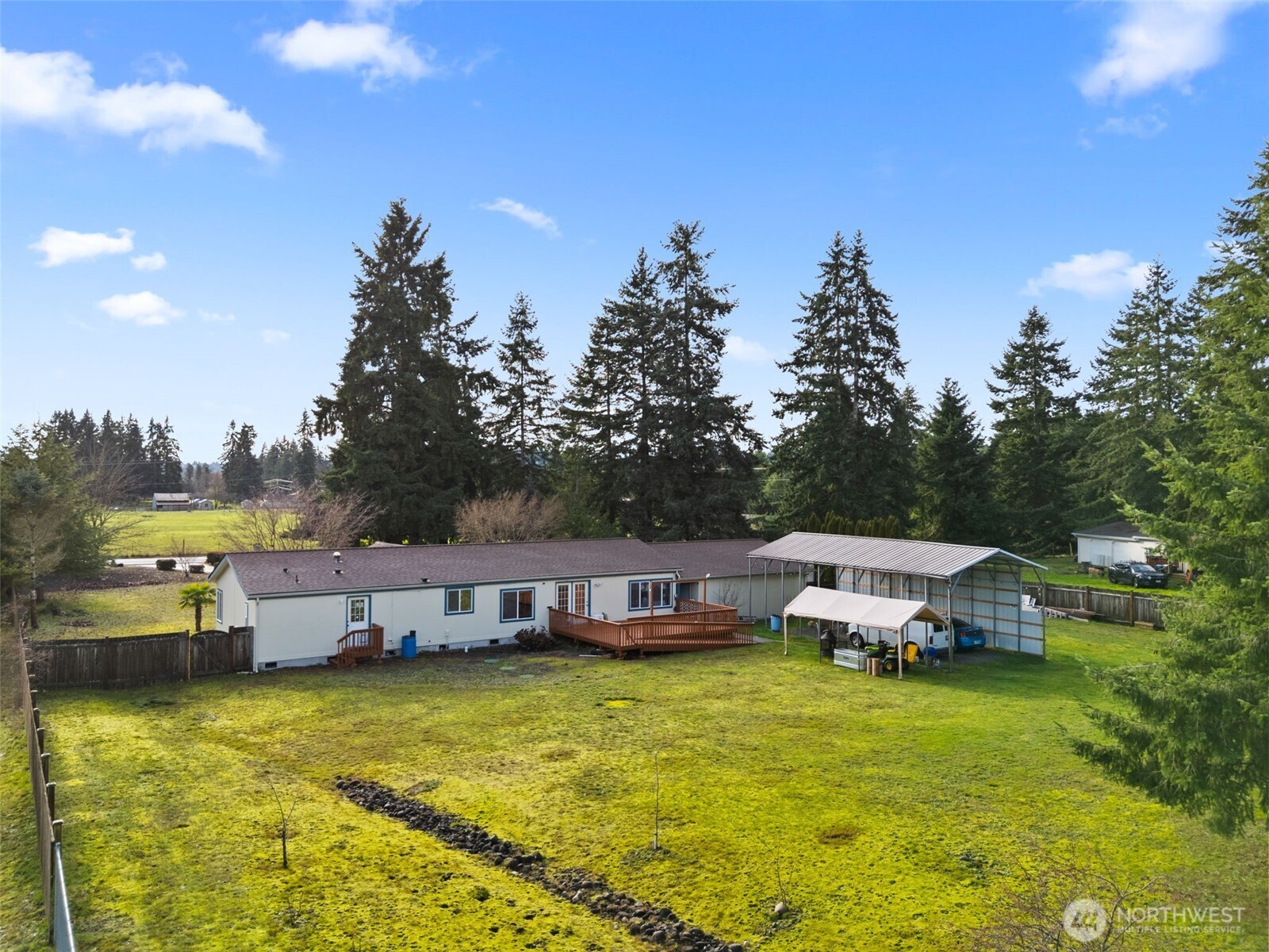 7808 197th Avenue Southwest Rochester, WA 98579 - Photo 35 of 37 a swimming pool with outdoor seating and yard