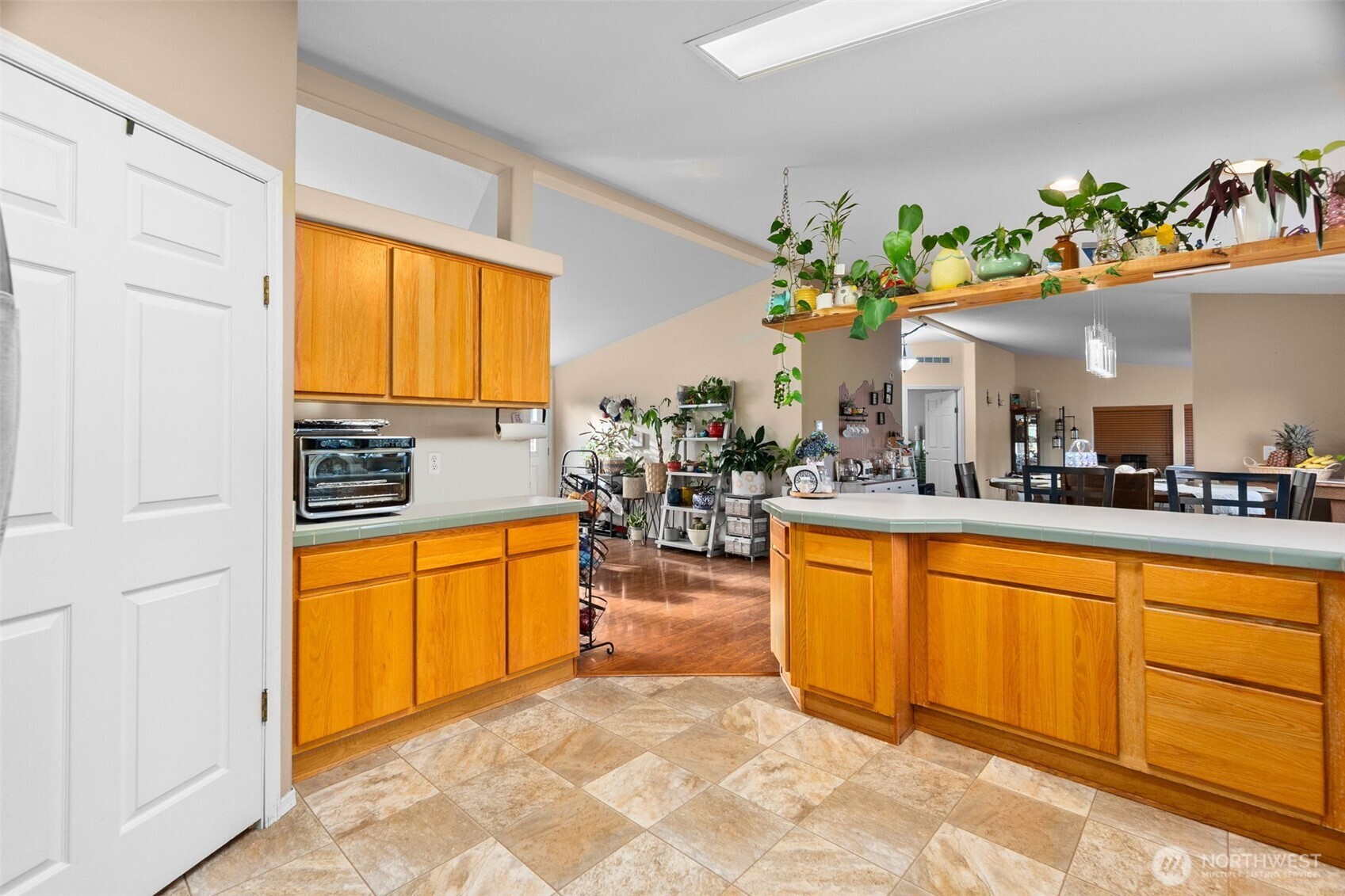7808 197th Avenue Southwest Rochester, WA 98579 - Photo 8 of 37 a large kitchen with stainless steel appliances granite countertop a granite counter tops and a view of living room