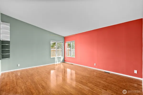 a view of an empty room with a window