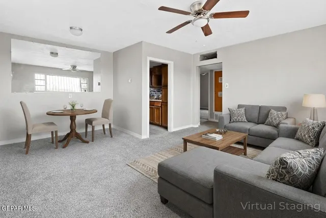 a living room with furniture and a window