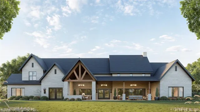 a view of a house next to a big yard