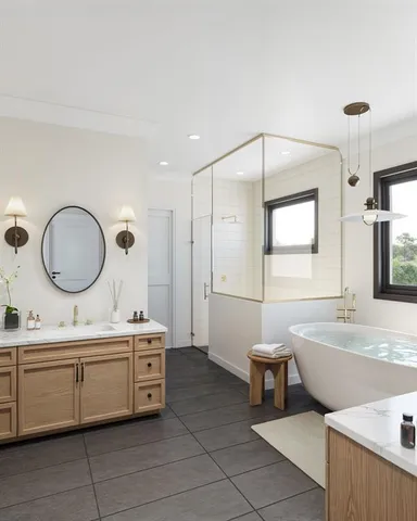 a bathroom with a double vanity sink a mirror and a bathtub