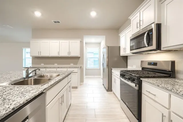 a large kitchen with cabinets