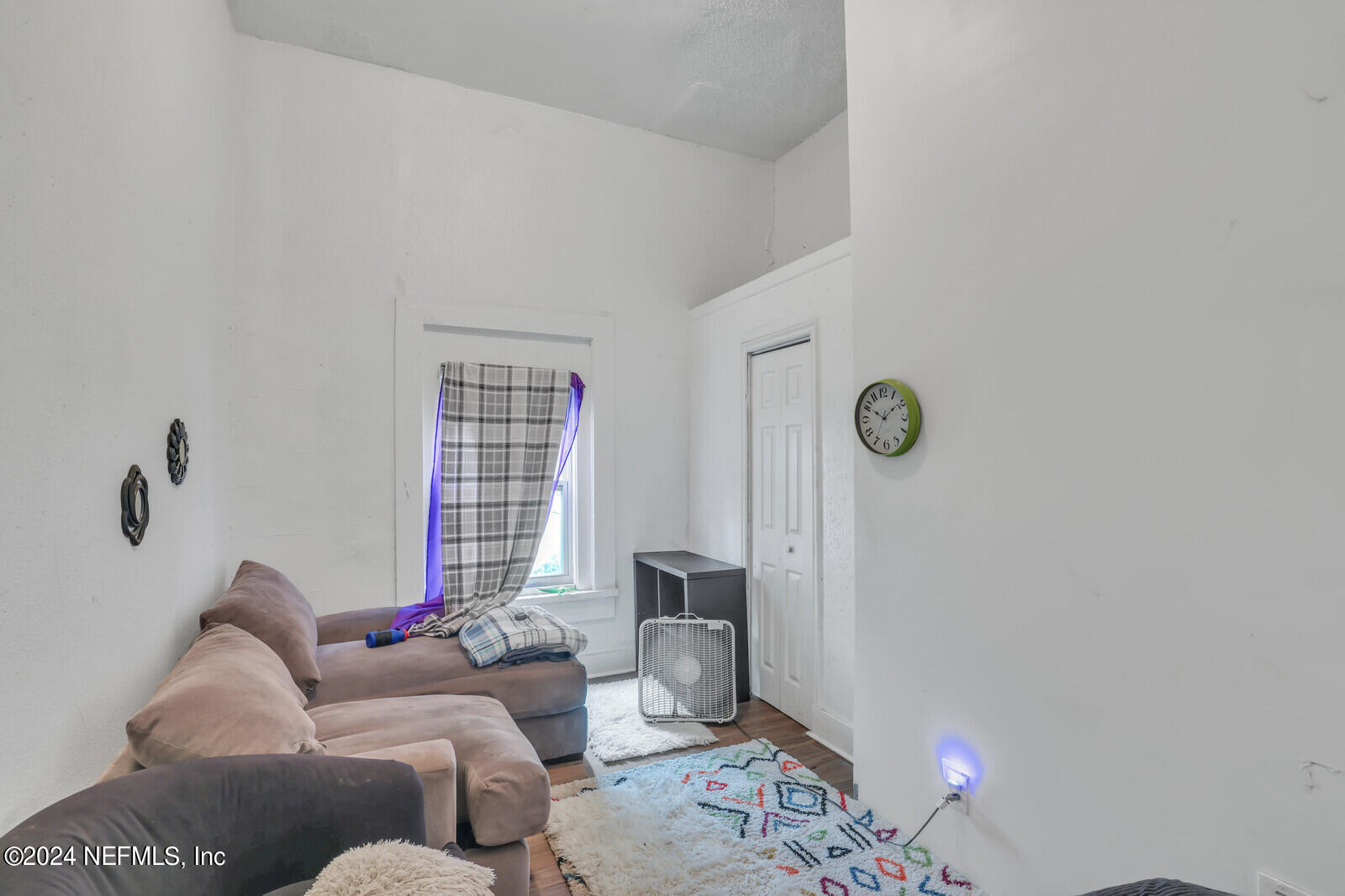 2306 Moncrief Road Jacksonville, FL 32209 - Photo 11 of 14 a living room with furniture and a window