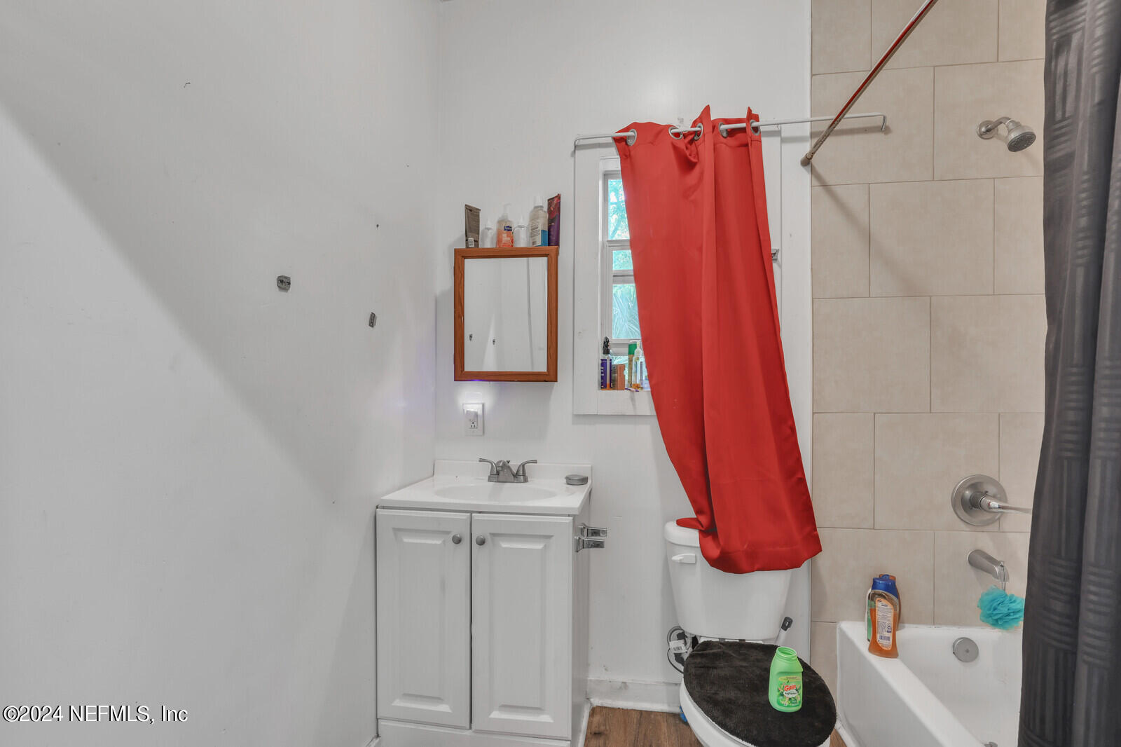 2306 Moncrief Road Jacksonville, FL 32209 - Photo 13 of 14 a bathroom with a sink and a mirror