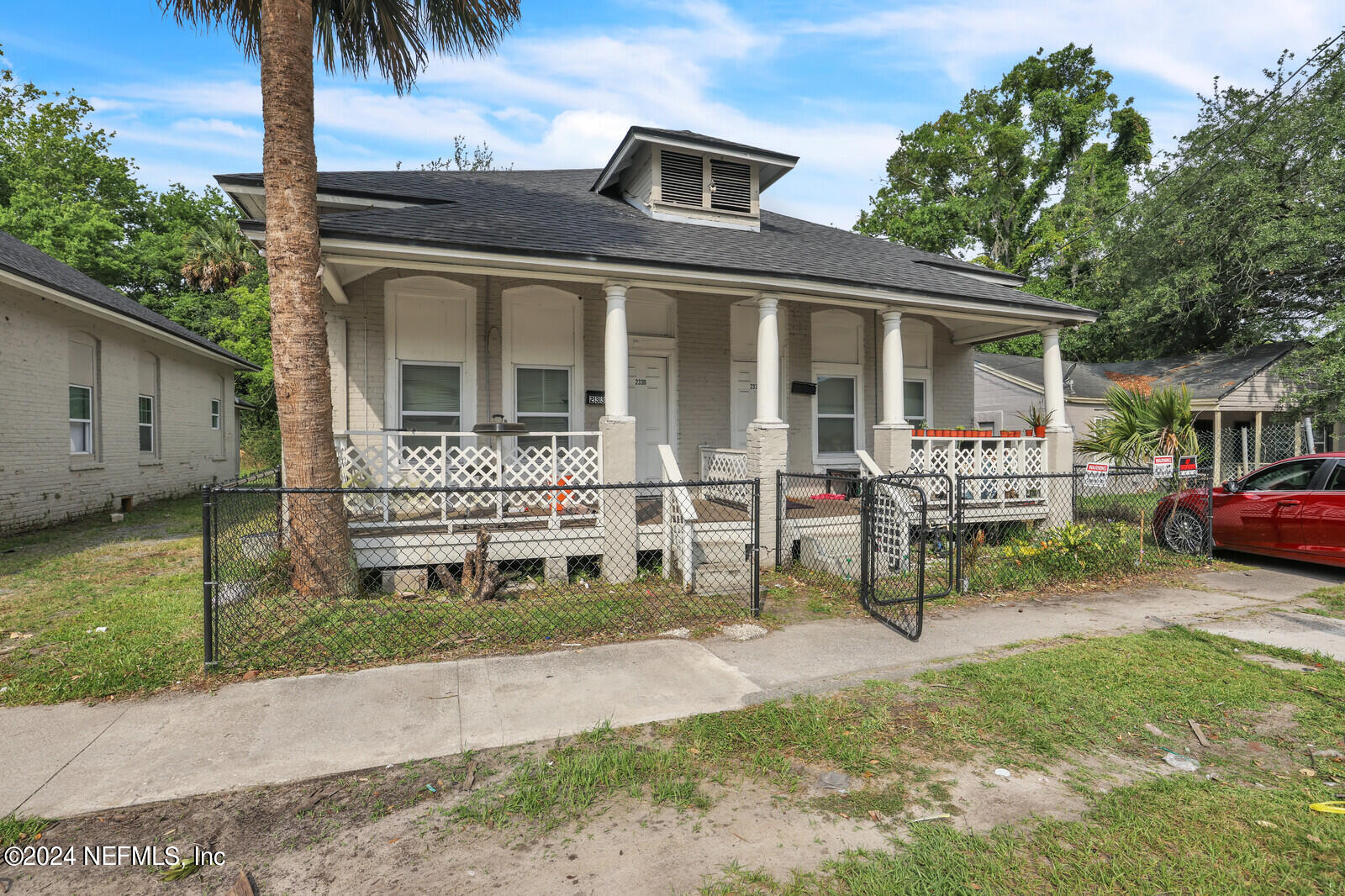 2306 Moncrief Road Jacksonville, FL 32209 - Photo 8 of 14 a front view of a house with a yard table and chairs