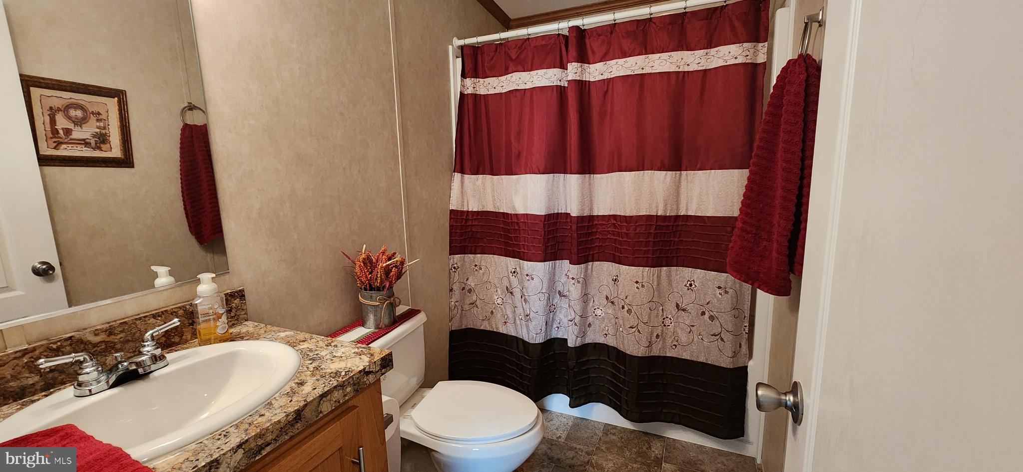 77 Pine Ridge Boulevard Whiting, NJ 08759 - Photo 11 of 49 a bathroom with a sink and toilet