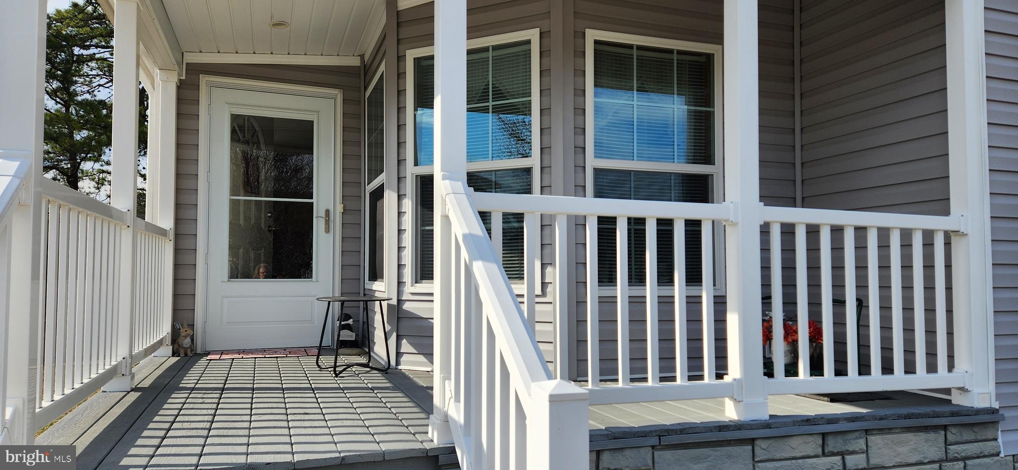 77 Pine Ridge Boulevard Whiting, NJ 08759 - Photo 15 of 49 a view of a balcony with wooden floor and fence