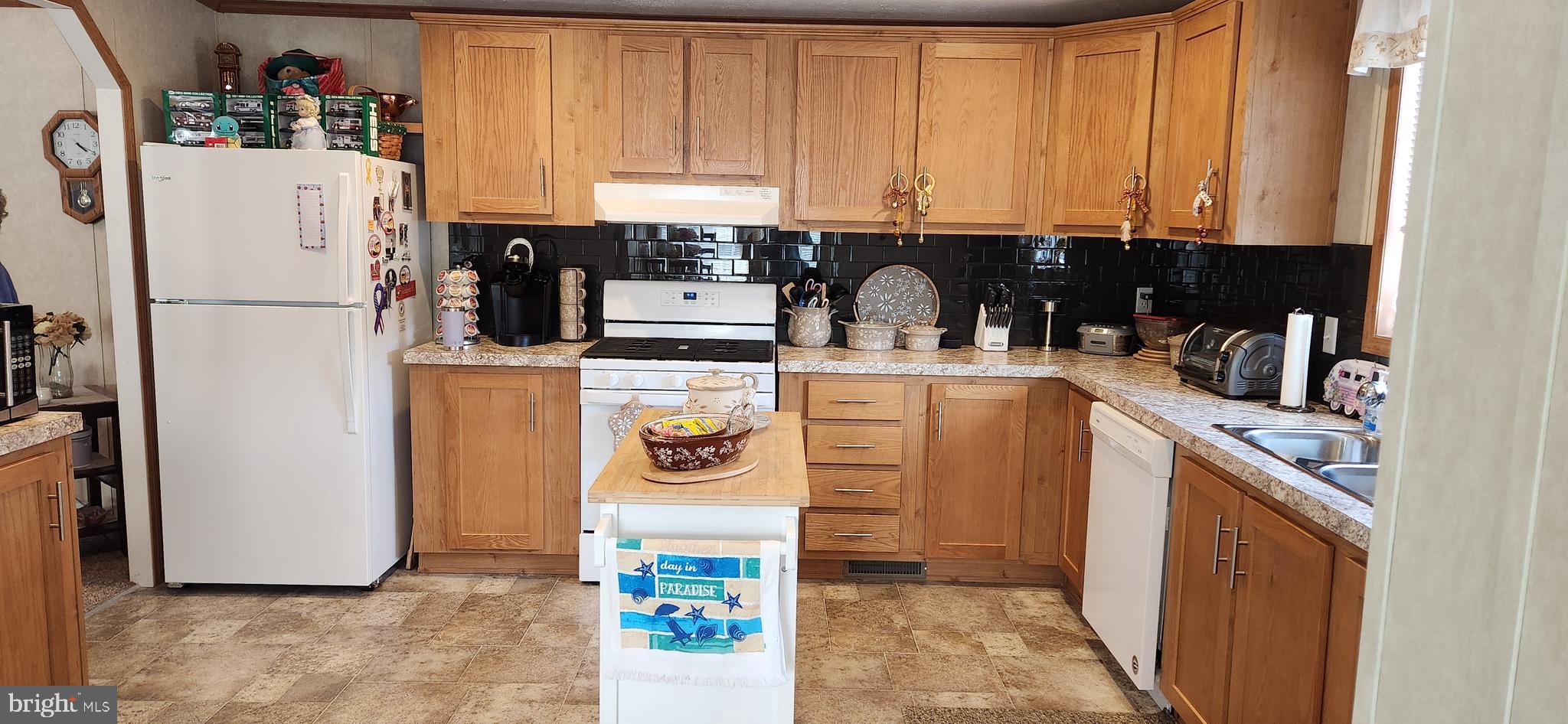 77 Pine Ridge Boulevard Whiting, NJ 08759 - Photo 17 of 49 a kitchen with a refrigerator and a stove top oven
