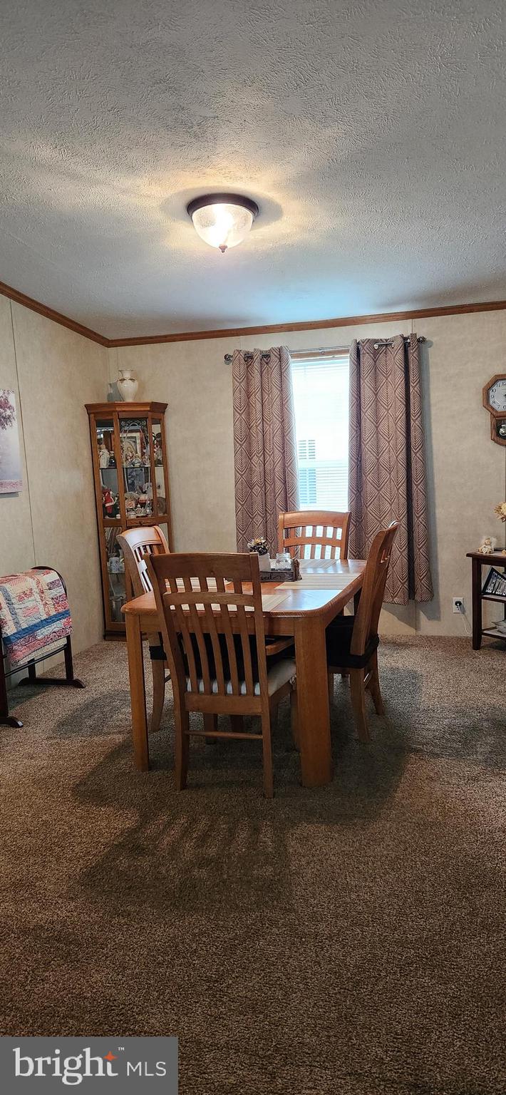 77 Pine Ridge Boulevard Whiting, NJ 08759 - Photo 18 of 49 a outdoor dining space with furniture and window