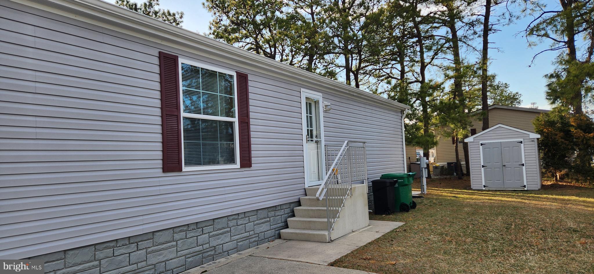 77 Pine Ridge Boulevard Whiting, NJ 08759 - Photo 19 of 49 a view of a house with a yard and garage