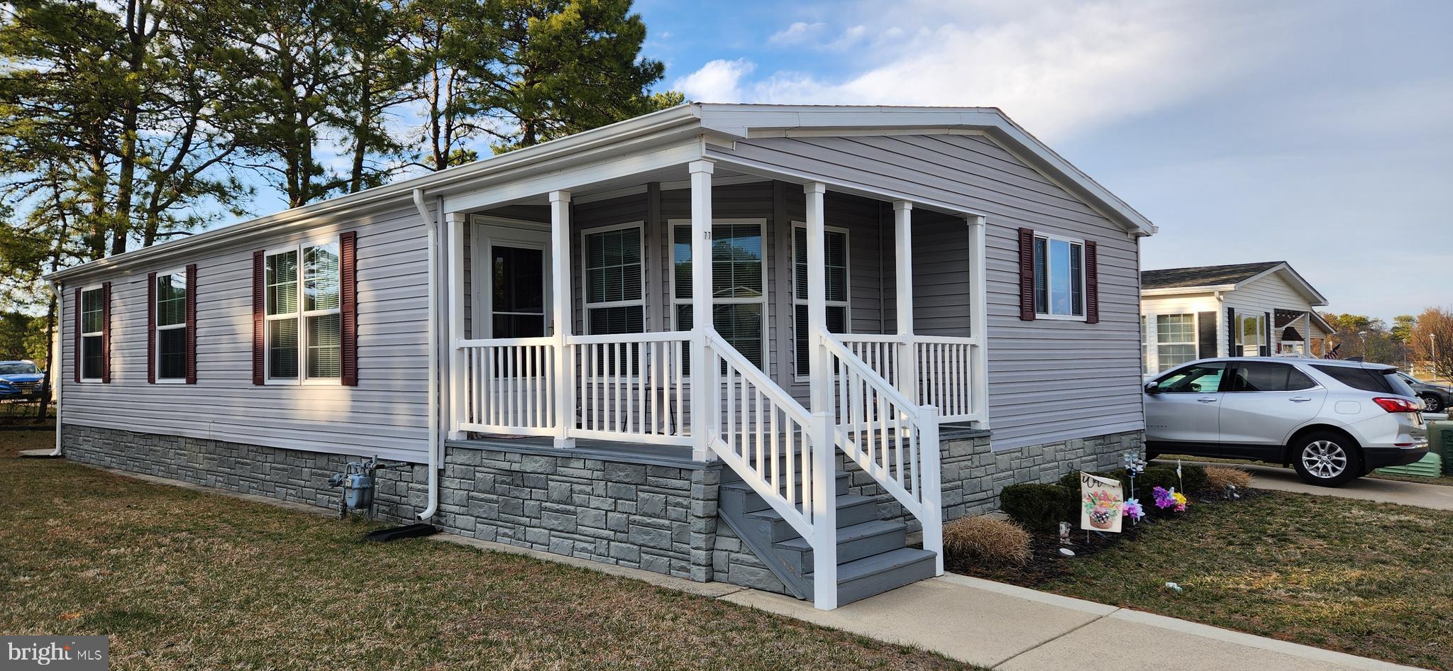 77 Pine Ridge Boulevard Whiting, NJ 08759 - Photo 22 of 49 a front view of a house with a yard