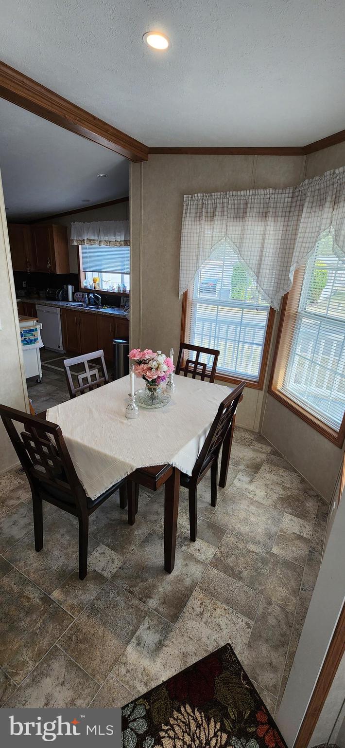 77 Pine Ridge Boulevard Whiting, NJ 08759 - Photo 3 of 49 a view of a dining room with furniture window and outside view