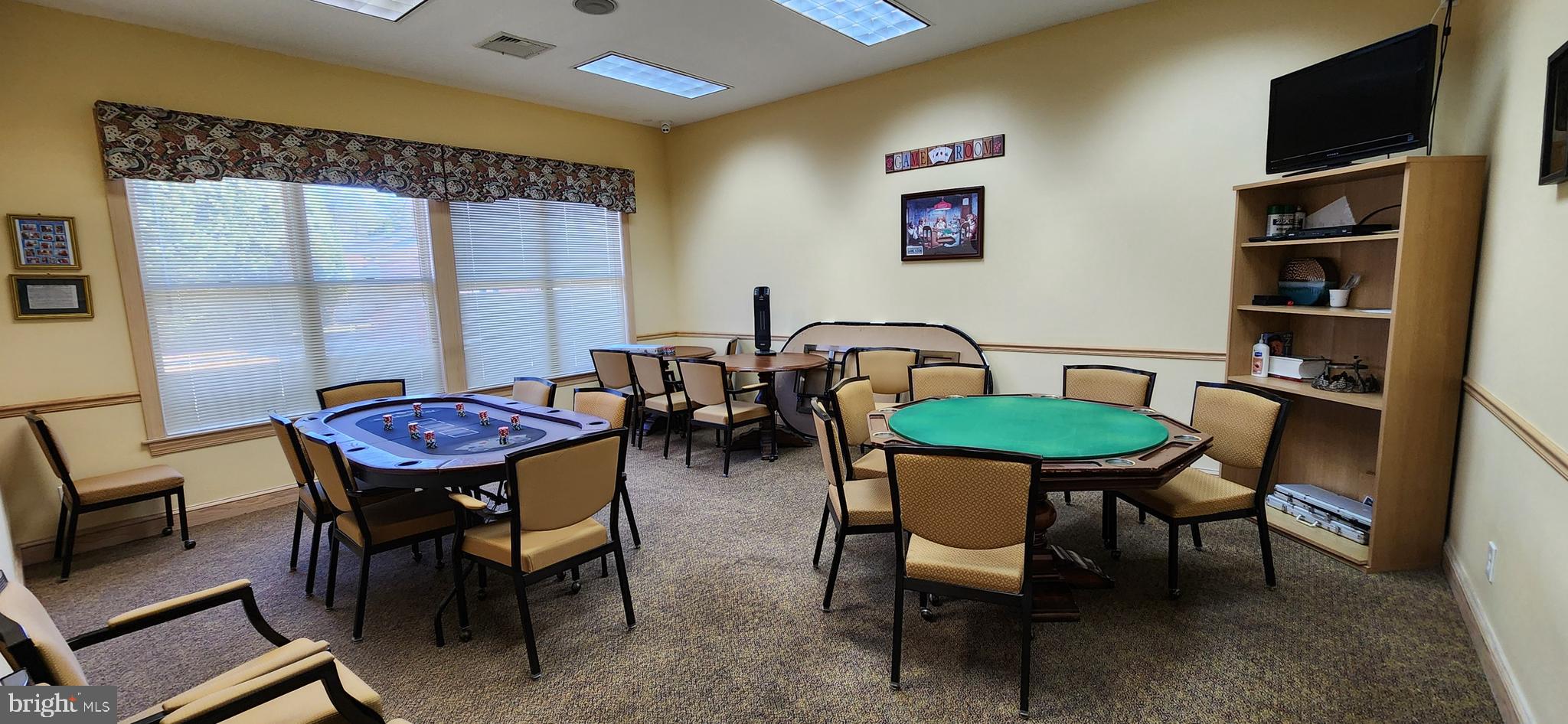 77 Pine Ridge Boulevard Whiting, NJ 08759 - Photo 32 of 49 a dining room with furniture and a floor to ceiling window
