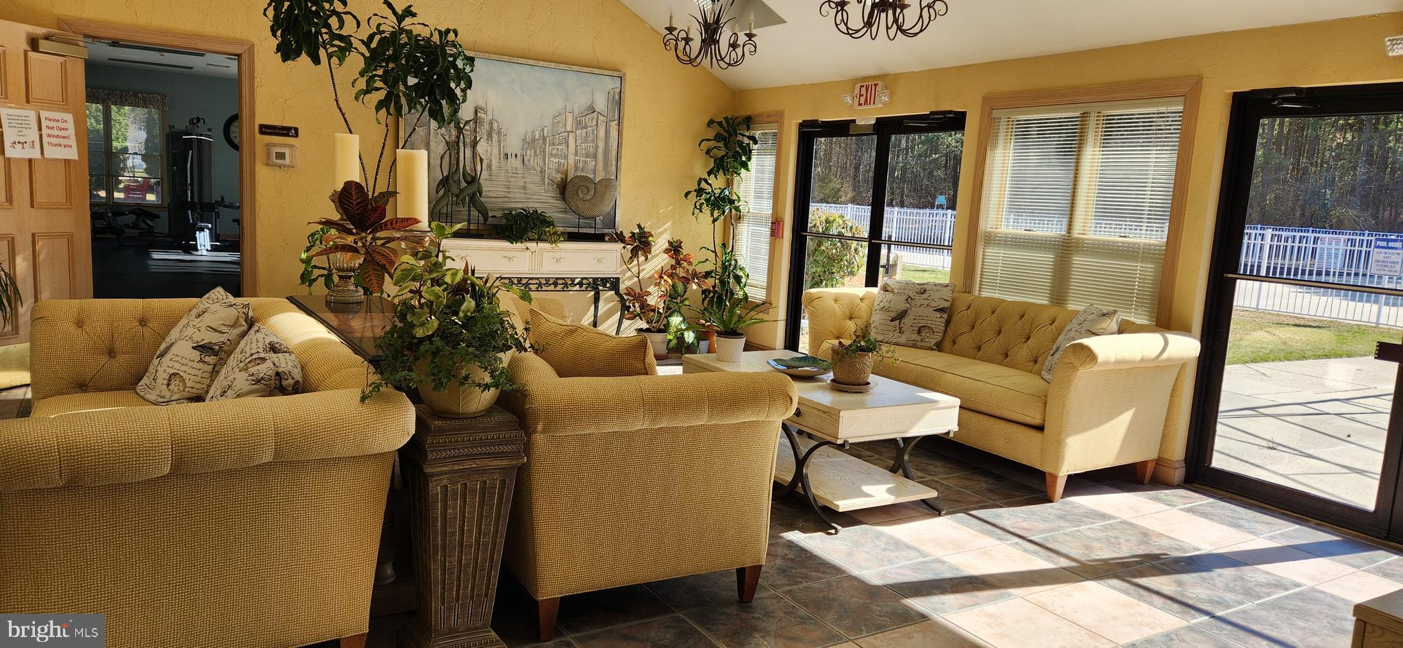 77 Pine Ridge Boulevard Whiting, NJ 08759 - Photo 35 of 49 a living room with furniture and a large window