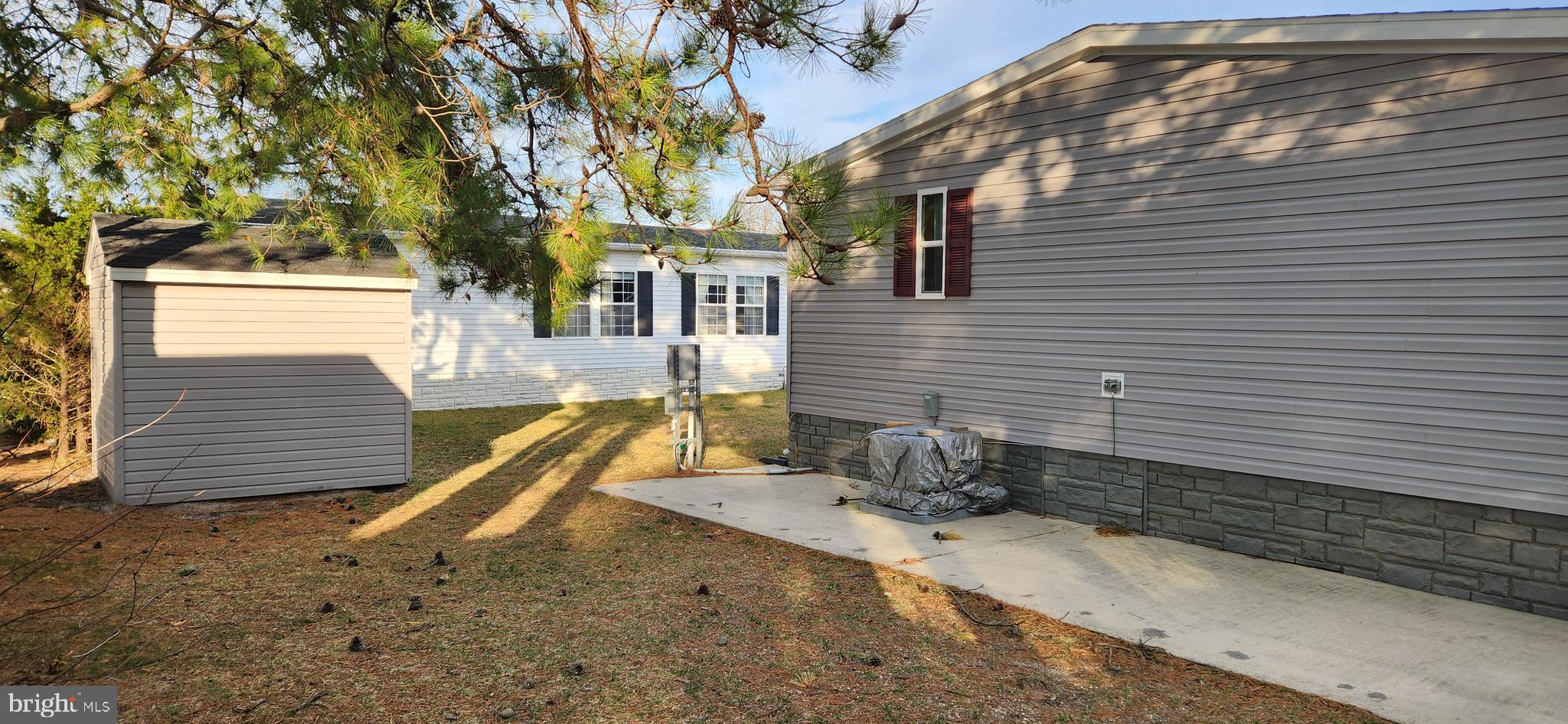 77 Pine Ridge Boulevard Whiting, NJ 08759 - Photo 43 of 49 a view of a backyard with a tree