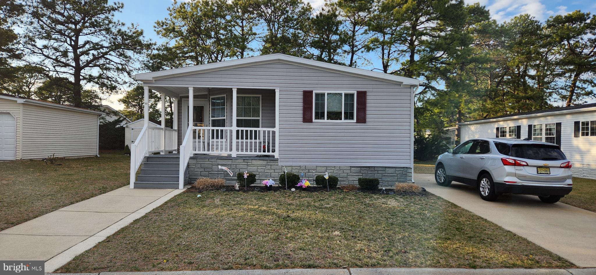 77 Pine Ridge Boulevard Whiting, NJ 08759 - Photo 45 of 49 a front view of a house with a yard