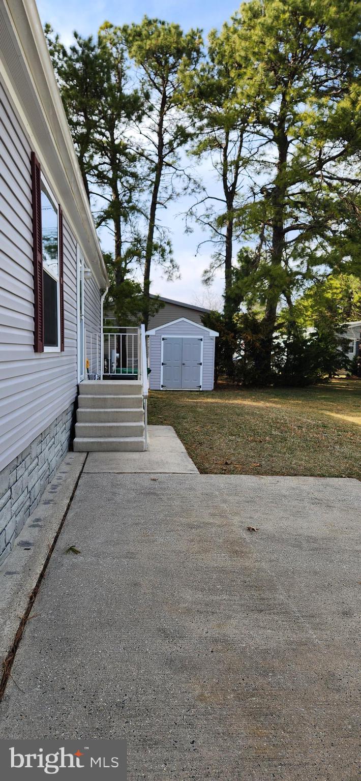 77 Pine Ridge Boulevard Whiting, NJ 08759 - Photo 47 of 49 a view of a yard in front of a house