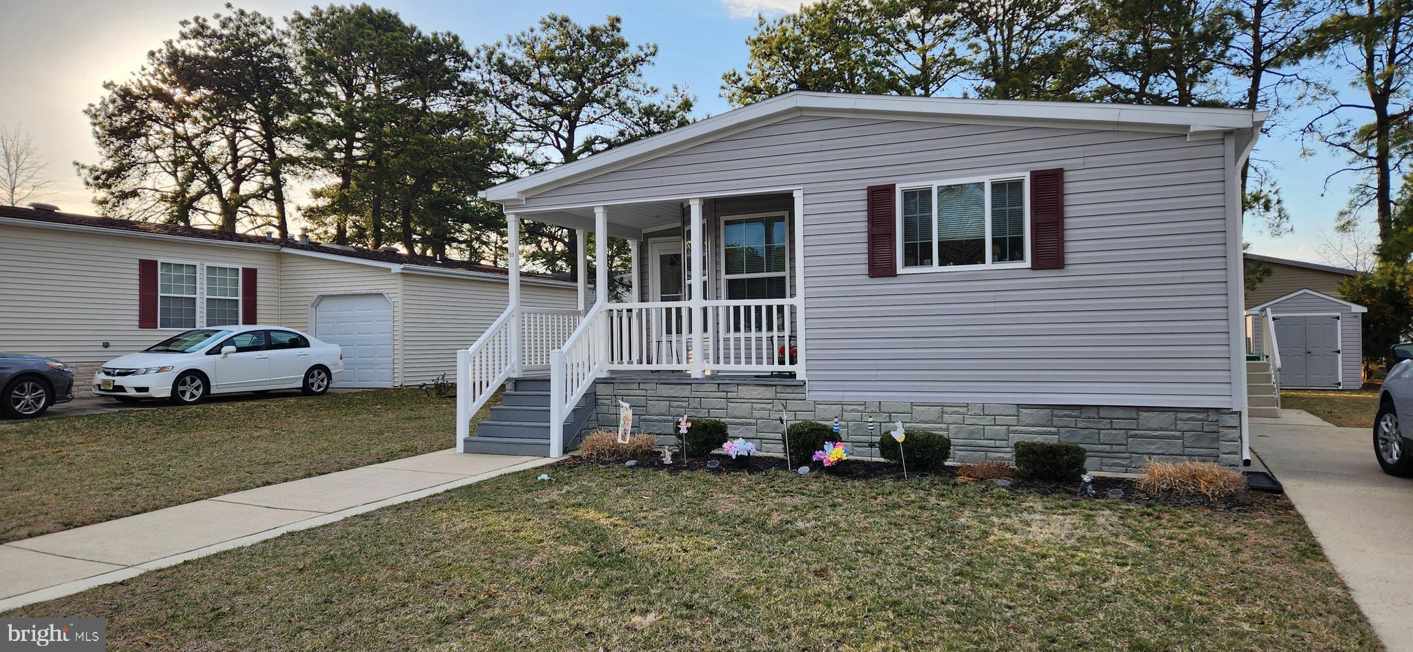 77 Pine Ridge Boulevard Whiting, NJ 08759 - Photo 48 of 49 a front view of a house with a yard