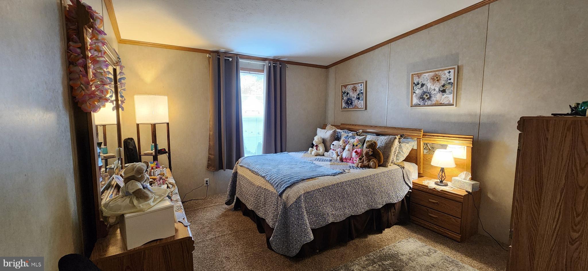 77 Pine Ridge Boulevard Whiting, NJ 08759 - Photo 8 of 49 a bedroom with a bed and a mirror