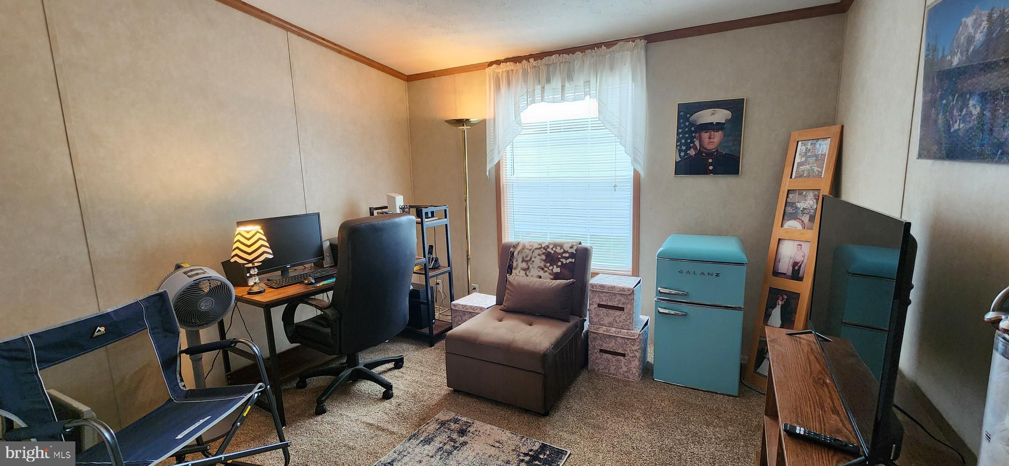 77 Pine Ridge Boulevard Whiting, NJ 08759 - Photo 10 of 49 a living room with furniture and a flat screen tv