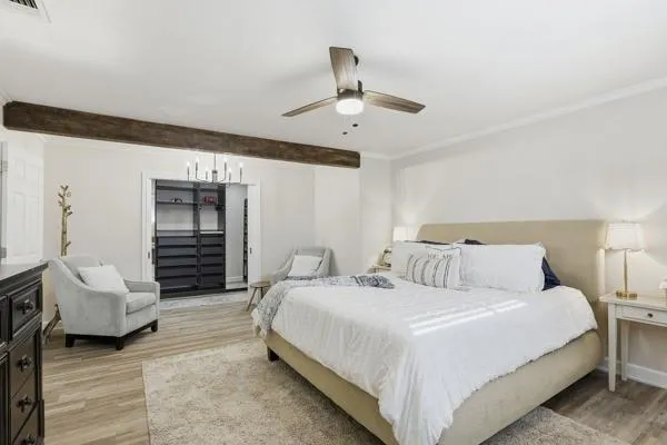 a bedroom with a bed and a couch