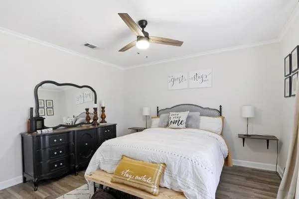 a bedroom with a bed and a dresser