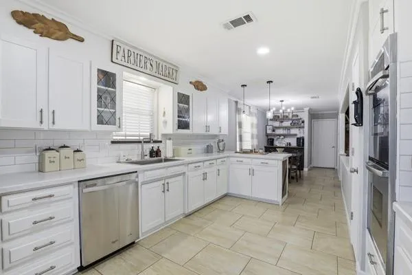 a large kitchen with a cabinets and a sink