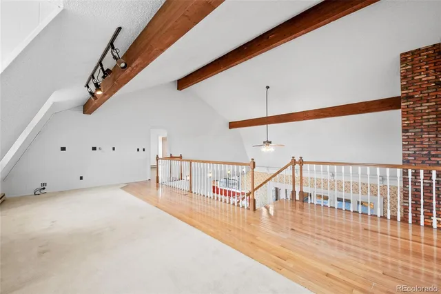 a view of a hallway with staircase