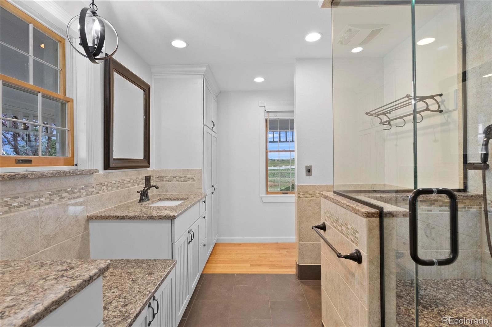 6231 Prospect Road Longmont, CO 80503 - Photo 20 of 45 a bathroom with double vanity sink and a mirror