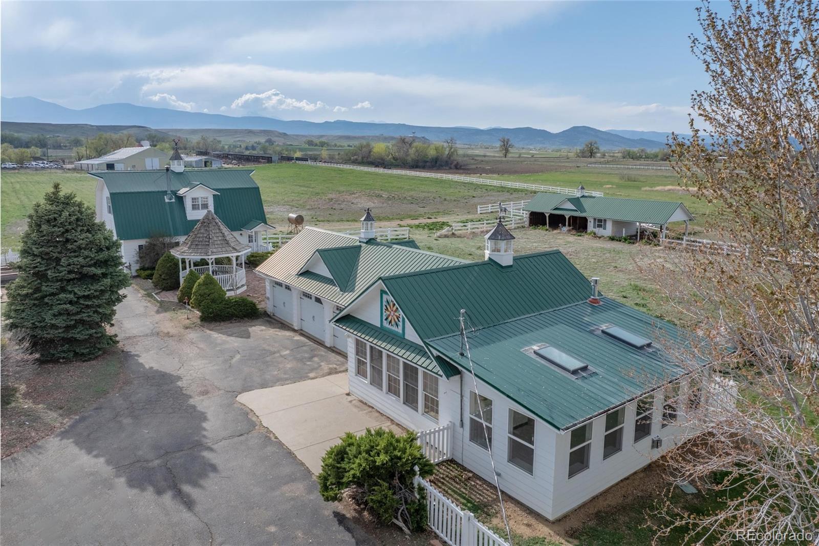 6231 Prospect Road Longmont, CO 80503 - Photo 2 of 45 an aerial view of a house with a garden
