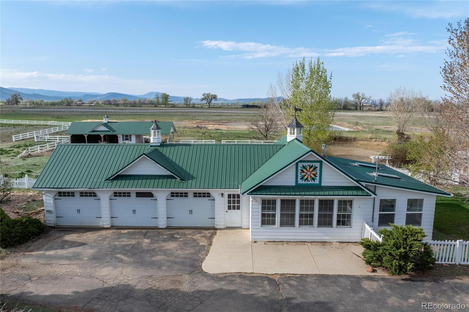 6231 Prospect Road Longmont, CO 80503 - Photo 29 of 45 a front view of a house with a yard and lake view