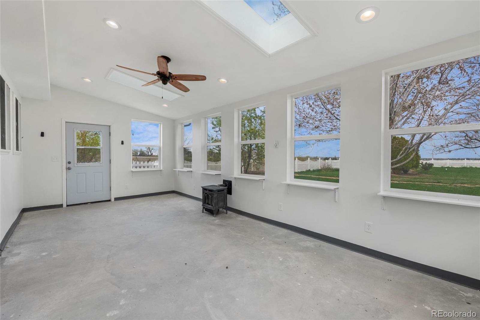 6231 Prospect Road Longmont, CO 80503 - Photo 33 of 45 wooden floor in an empty room with a window