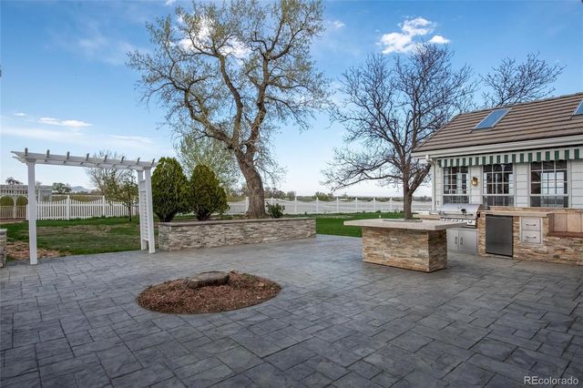 a swimming pool with outdoor seating and yard
