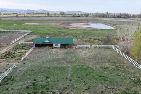 a view of lake with green space and mountain view