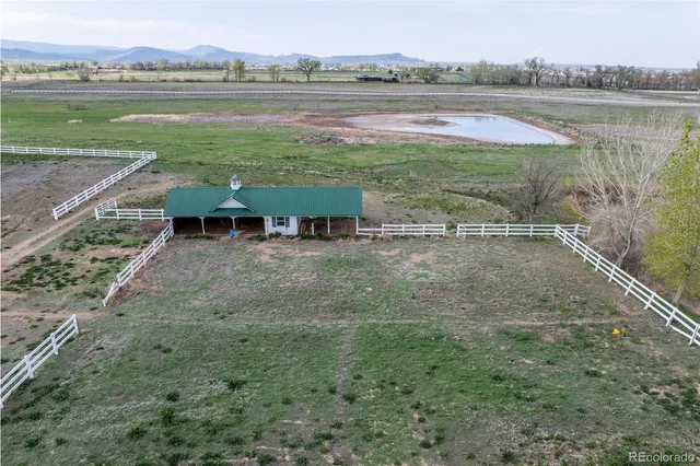 a view of lake with green space and mountain view