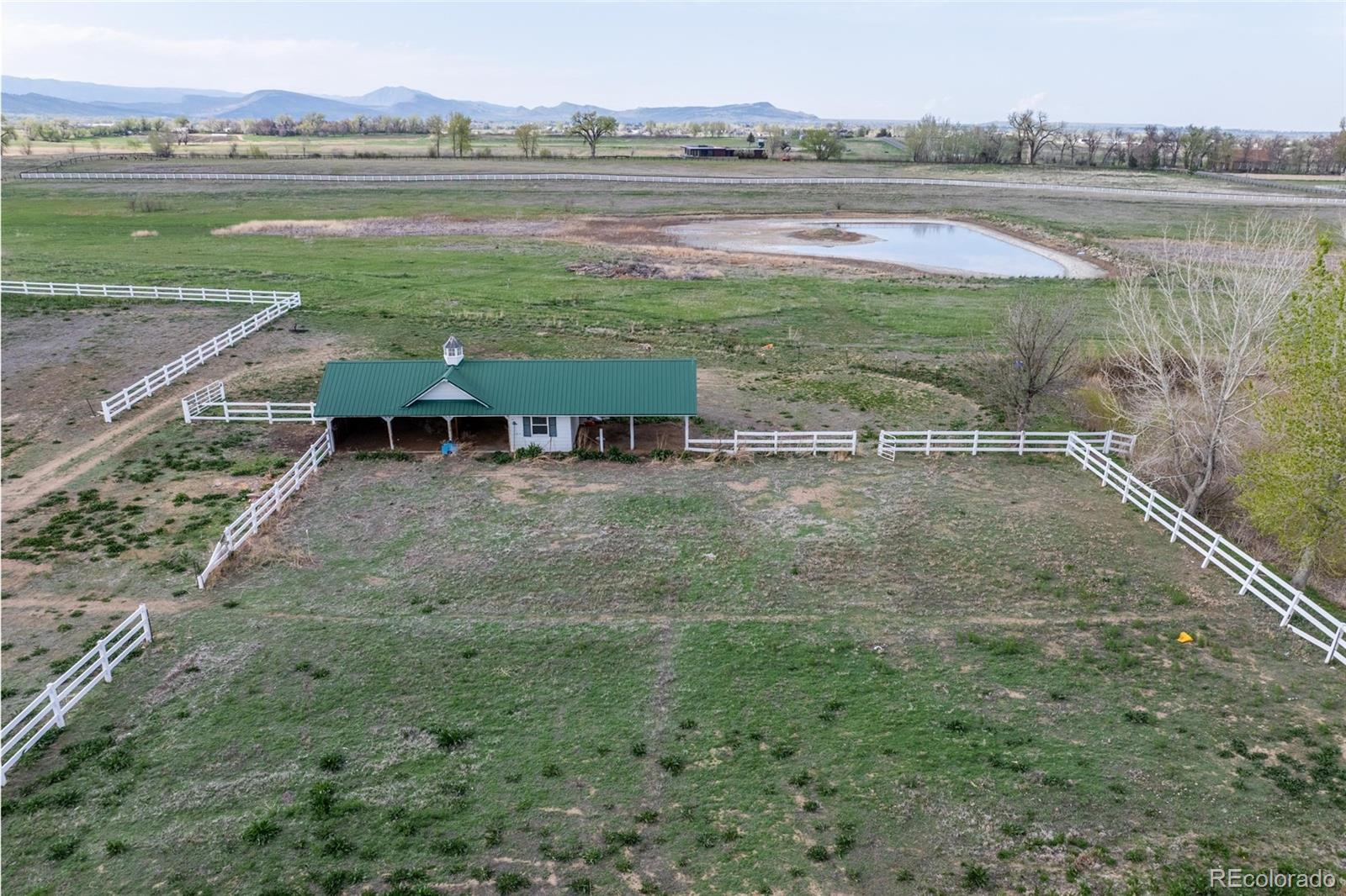 6231 Prospect Road Longmont, CO 80503 - Photo 44 of 45 a view of lake with green space and mountain view