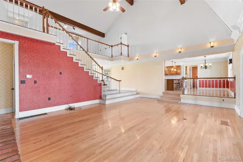 a view of a room with wooden floor