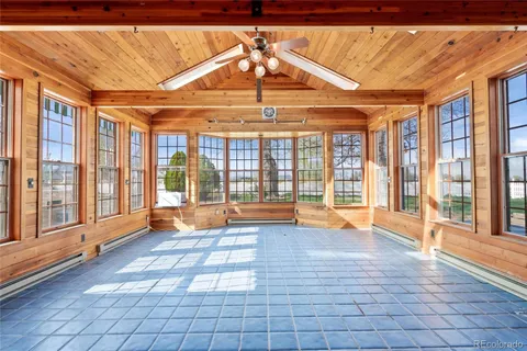 a view of an empty room with glass door