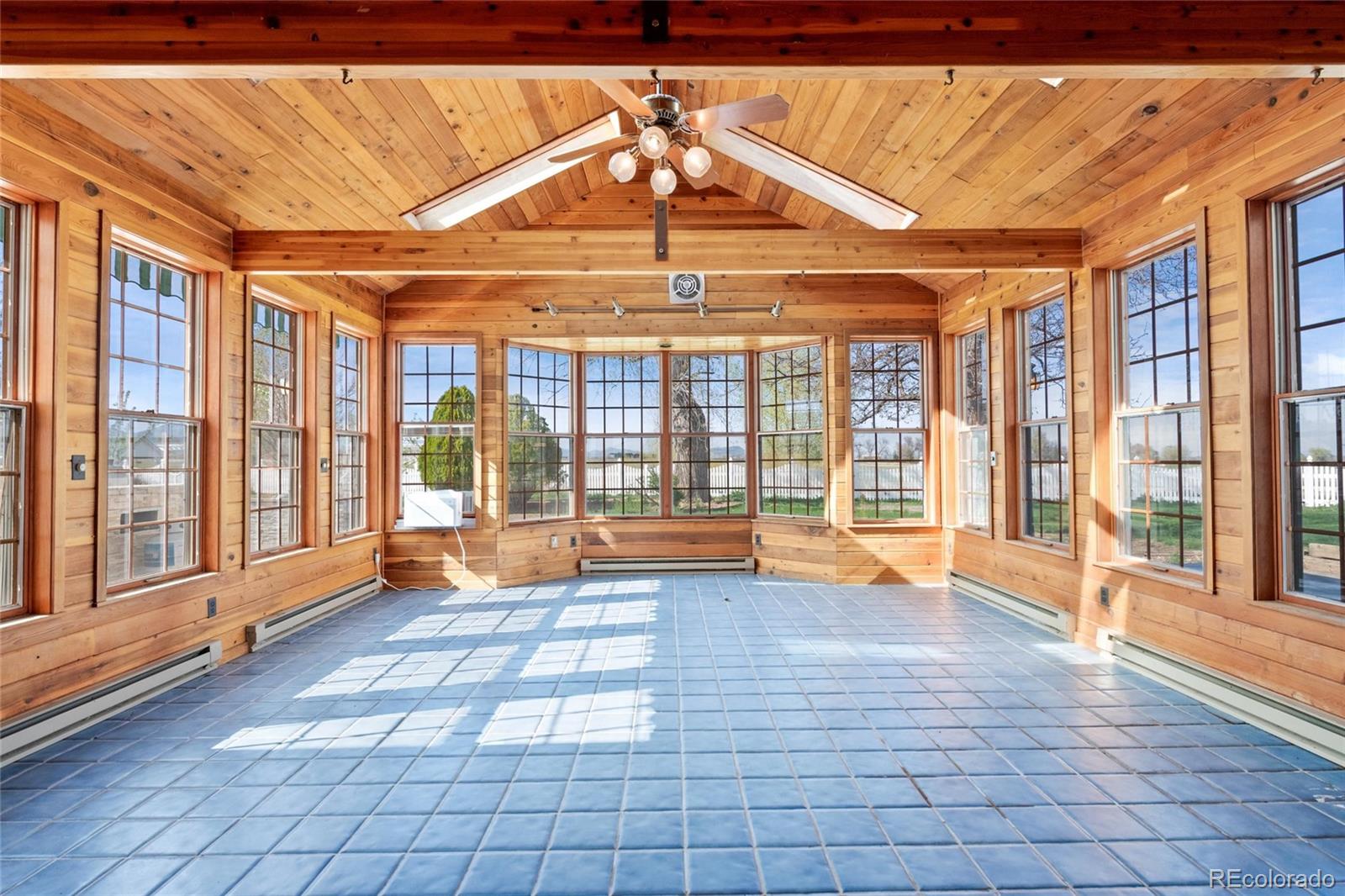 6231 Prospect Road Longmont, CO 80503 - Photo 8 of 45 a view of an empty room with glass door