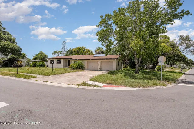 a view of house with outdoor space and trees