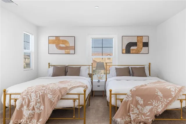 a bedroom with a bed and wall painting