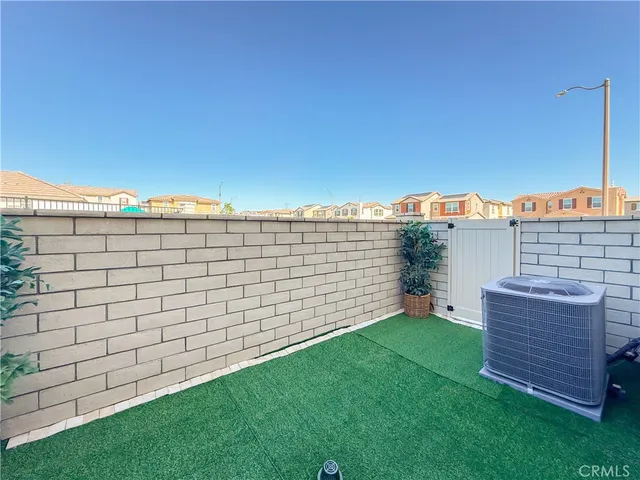 a view of an house with backyard space and garden