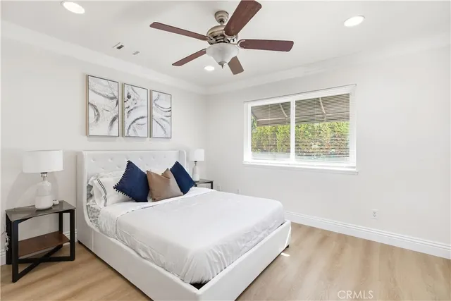 a bedroom with a large bed and a window